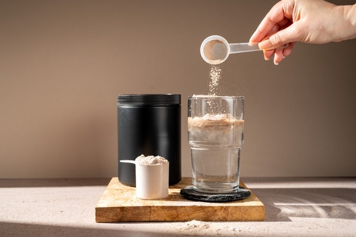 A person preparing a protein shake. ©Getty Images 