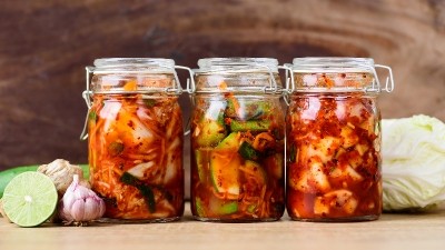 A higher intake of prebiotic and probiotic foods, such as kimchi, is linked to lower anxiety symptom severity. ©Getty Images
